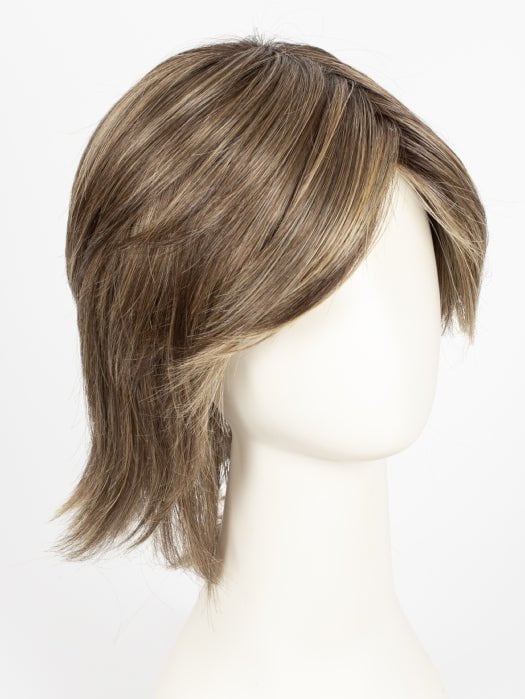 Raquel Welch Black Tie Chic wig in RL9/24SS Shaded Iced Cafe Latte, shown on a mannequin
