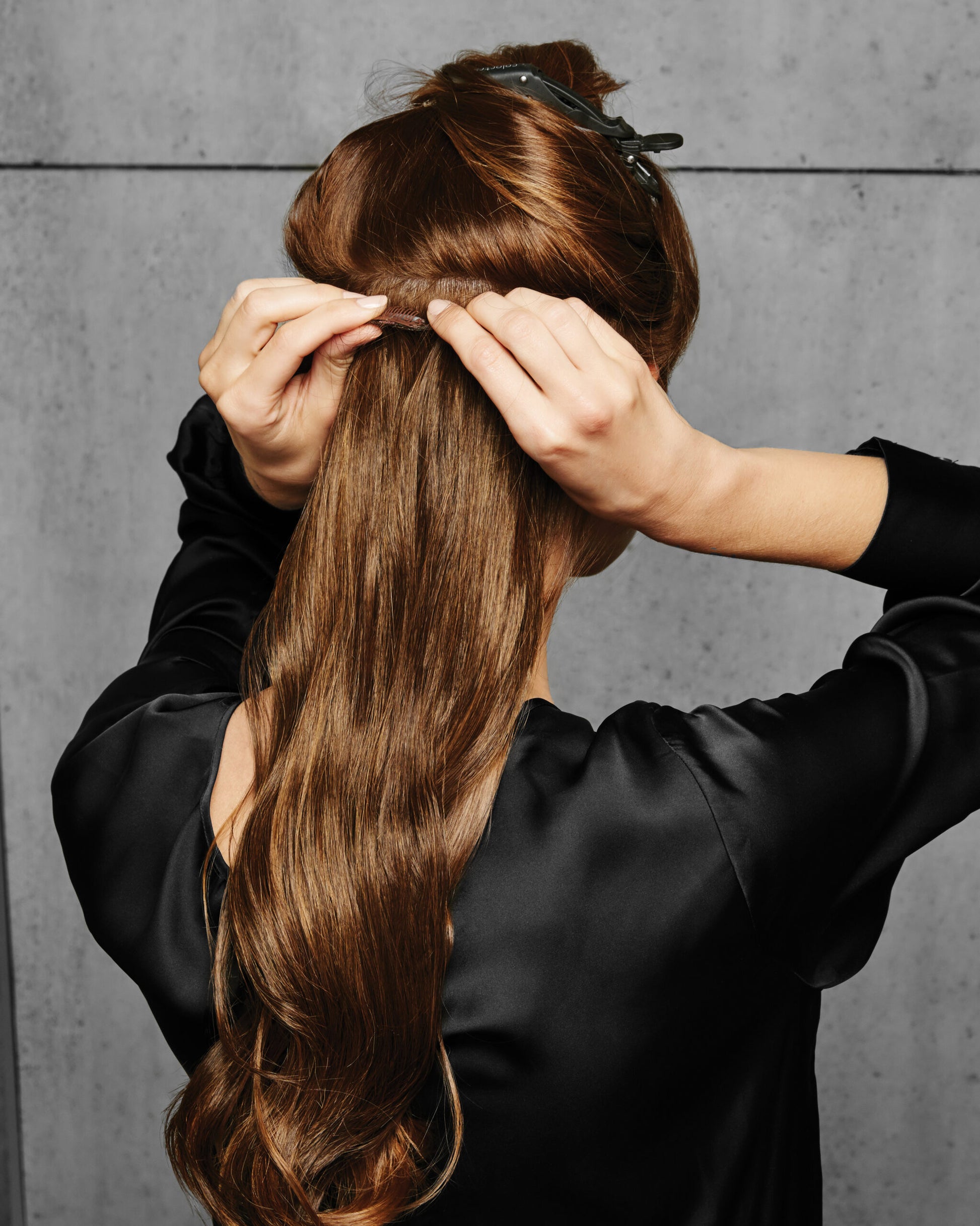 How to clip in the Hairdo 18 inch wavy extension, step two