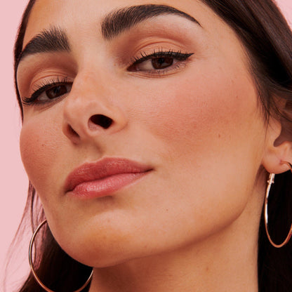 Model wearing Benefit Roller Liner black liquid eyeliner, winged eyeliner look