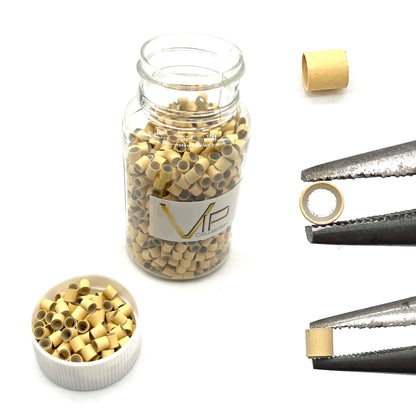 VIP Extensions silicone lined copper tube micro rings, colour 13 blonde, 1000 pieces per bottle, shown with pliers