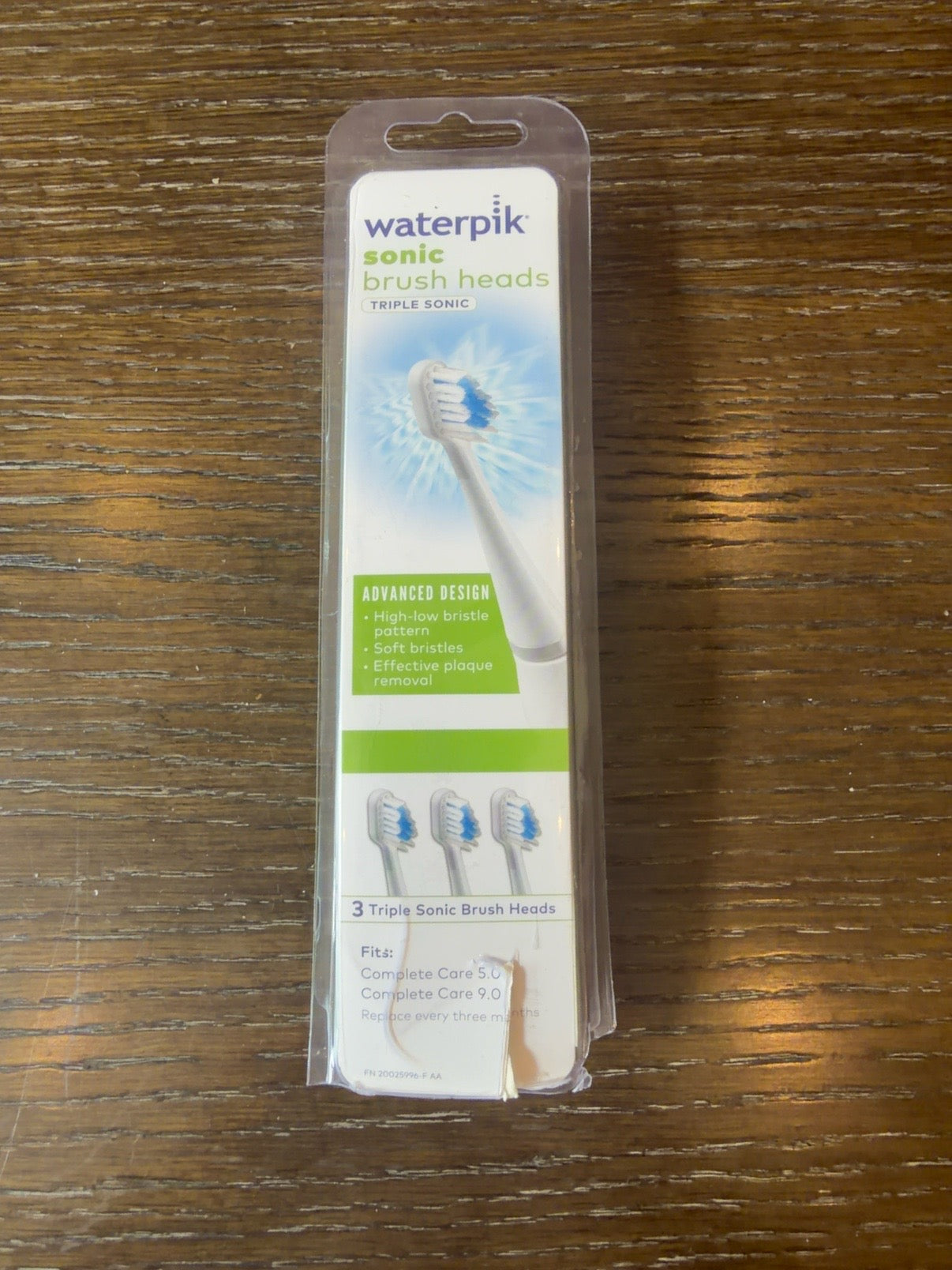 Waterpik Triple Sonic STRB-3WW brush heads 3-pack with visible front packaging tear
