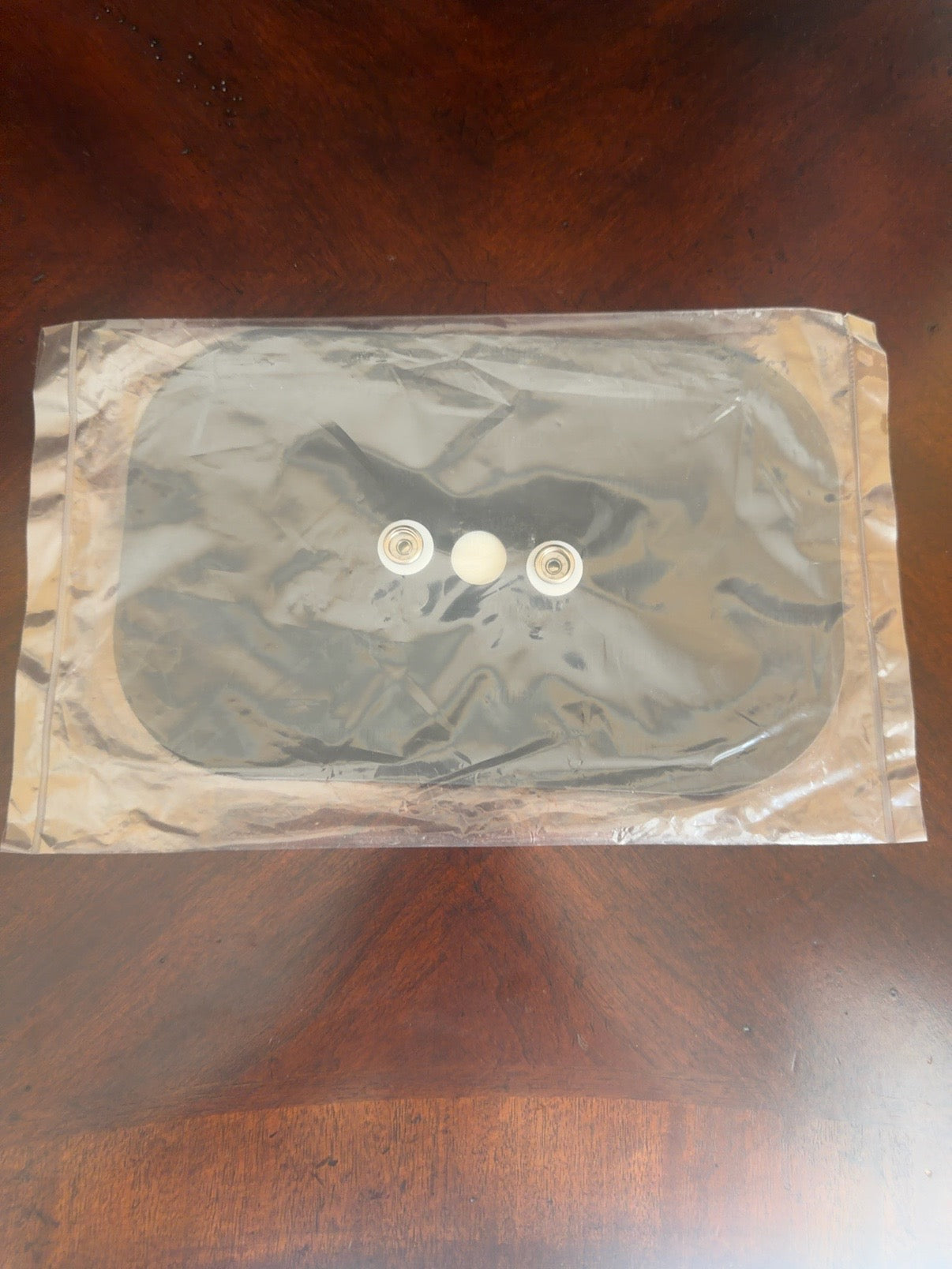 Zeltiq CoolSculpting CoolSmooth PRO center securement plate shown in sealed package
